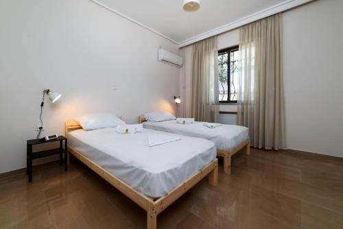 Postel nebo postele na pokoji v ubytování Spacious Nest 2bd apartment next to Acropolis
