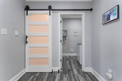 a sliding door in a room with a hallway at Luxury Condo in Gulfport in Gulfport