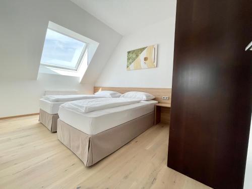 Postel nebo postele na pokoji v ubytování Reinisch Apartments