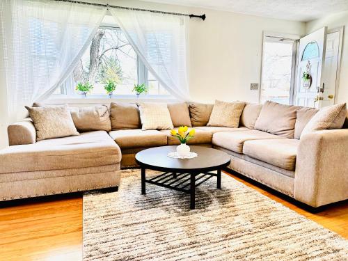 a living room with a couch and a table at Sunshine Palace in West Chester