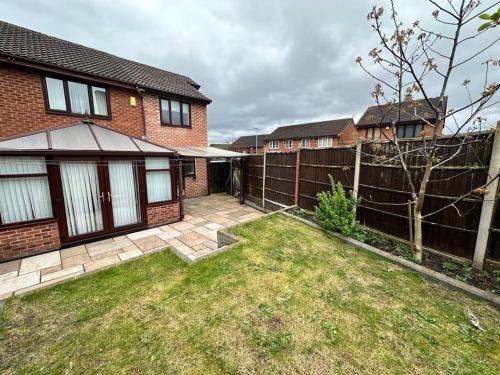 a backyard of a house with a fence at Sage House - City centre Hanley, Alton towers in Stoke on Trent