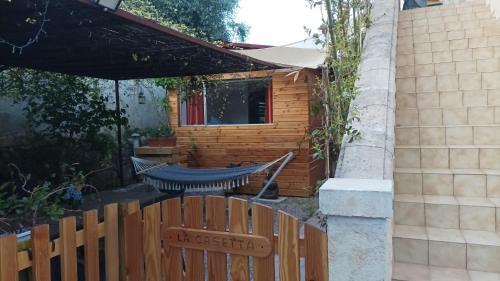 a hammock in the backyard of a house at La Casetta in Gattières