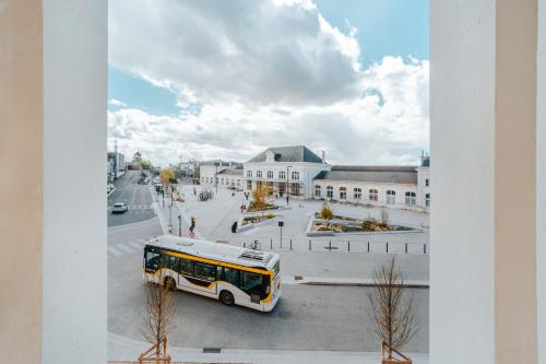 a bus is parked on a city street at Beelodge Hotel Blois Centre in Blois