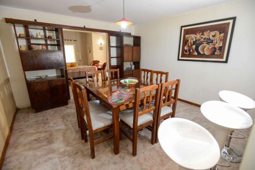 a dining room with a table and chairs at El Refugio in Ciudad Lujan de Cuyo