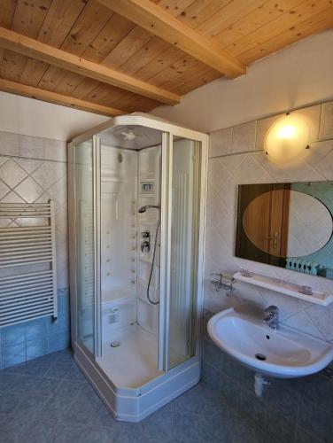 a bathroom with a shower and a sink at Attico in Centro: Relax&Comfort in Baselga di Pinè