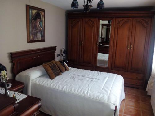 En eller flere senger på et rom på Casa Hortensia