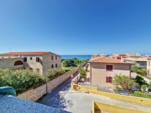 a view of the ocean from the balcony of a building at L'onda marina in Castelsardo