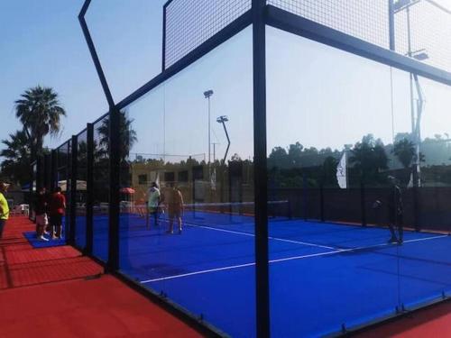 a group of people playing tennis on a tennis court at Loft Marinella l'aereoporto di Lamezia sul mare Kitesurf in SantʼEufemia Lamezia