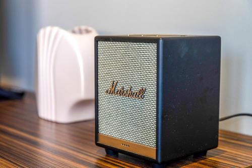a black speaker sitting on top of a wooden floor at SENSES Boutique Hotel & Apartments in Kralendijk