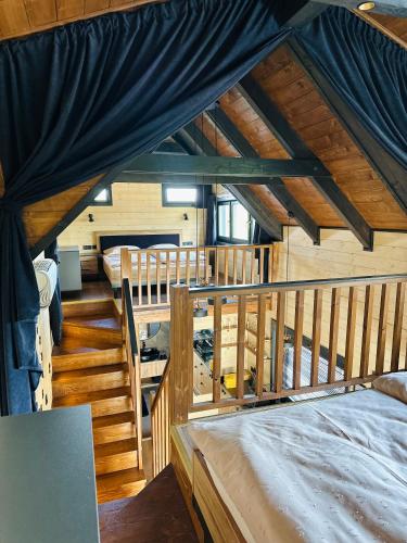 a room with two beds in a cabin at BeLaWood in Egerszalók