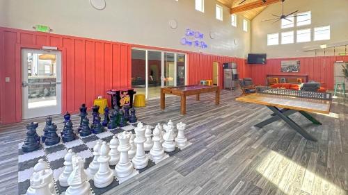 a room with a chess board and a large chessboard at The Commons - Urban Coastal Lodging in Seaside