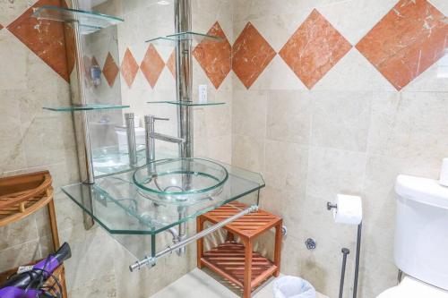 a glass shelf in a bathroom with a toilet at Komffy Penthouse w/ King Bed & Ocean View at Tides in Hollywood
