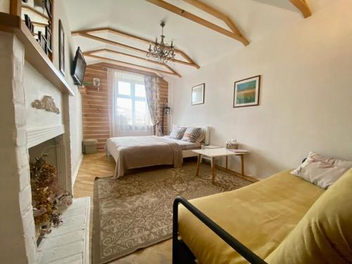 a bedroom with two beds and a fireplace at Краківська 34 не далеко від ж д вокзалу Звітні документи in Lviv