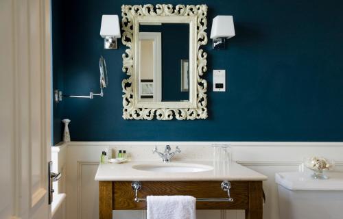 a bathroom with a sink and a mirror at The Marine in Whitstable