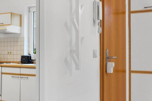 a white door in a kitchen with a counter at WINETIME - für 3 - nähe Madenburg - Burg Landeck in Eschbach
