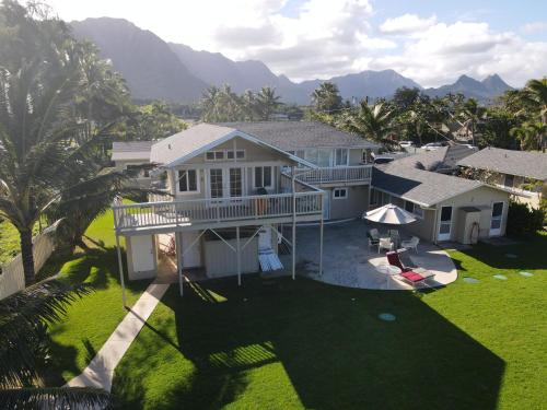an aerial view of a house with a yard at Waimanalo Beach Cottages in Waimanalo