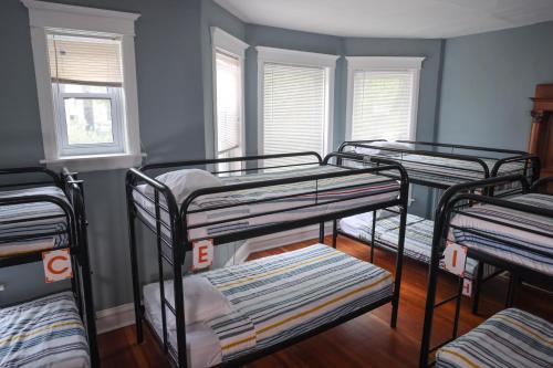 a group of bunk beds in a room at Wrigley Hostel - Chicago in Chicago