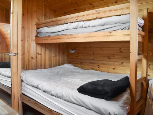 a bedroom with two bunk beds in a cabin at Barn Scar-uk1394 in Corney