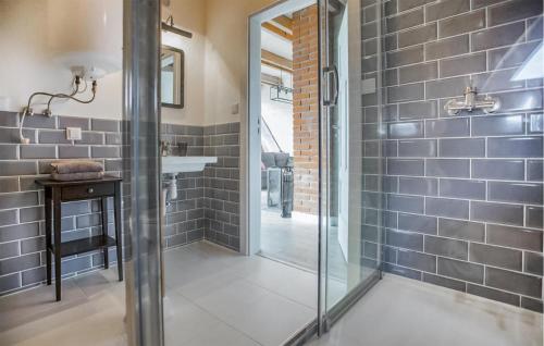 a bathroom with a glass shower and a sink at Beautiful Apartment In Sorkwity With House A Panoramic View in Sorkwity
