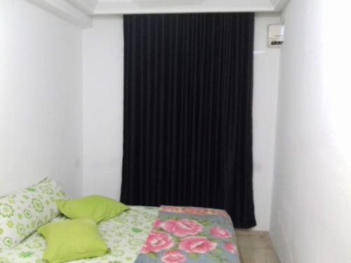 Ένα ή περισσότερα κρεβάτια σε δωμάτιο στο Appartement meublé centre ville de Tunis