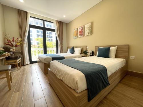 Кровать или кровати в номере Teddy 108 Homestay & Cafe - 3 stars - Grand World Phu Quoc