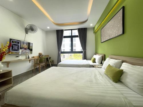 Кровать или кровати в номере Teddy 108 Homestay & Cafe - 3 stars - Grand World Phu Quoc