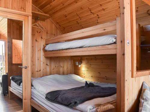 a bedroom with two bunk beds in a wooden cabin at Stainton-uk1395 in Corney