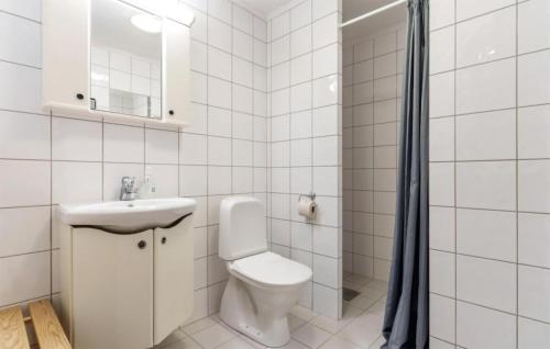 a white bathroom with a toilet and a sink at Nice Apartment In Hemsedal With House A Mountain View in Hemsedal
