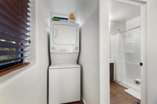 a washer and dryer in a white room at Mammoth Rock Oasis Villa-Hot Tub & Free Pets in Sedona