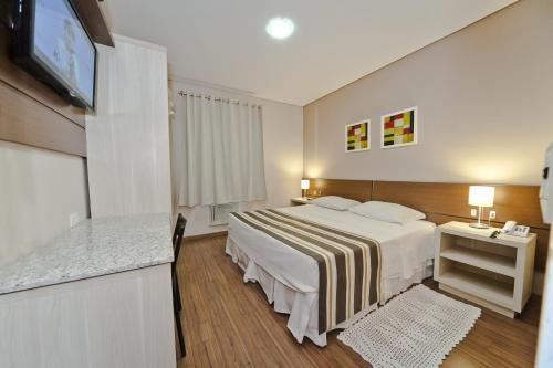 Postel nebo postele na pokoji v ubytování Hotel Sol By MRHotelaria