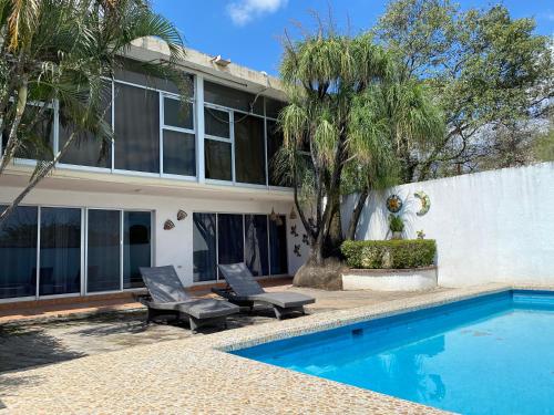 a house with a swimming pool in front of a house at Casa Valle Alto in Ciudad Valles