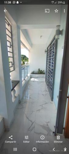 an empty hallway of a building with two windows at Señora Minerva in Hainamosa