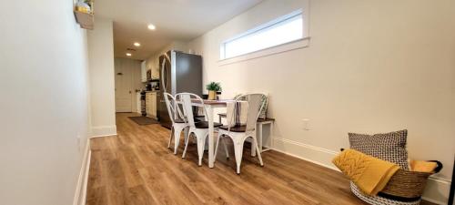 a kitchen and dining room with a table and chairs at Entire Spacious Vacation Home - 1 mile to all Attractions in New Orleans
