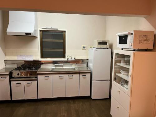 Virtuvė arba virtuvėlė apgyvendinimo įstaigoje Origami Chalet - Riverside