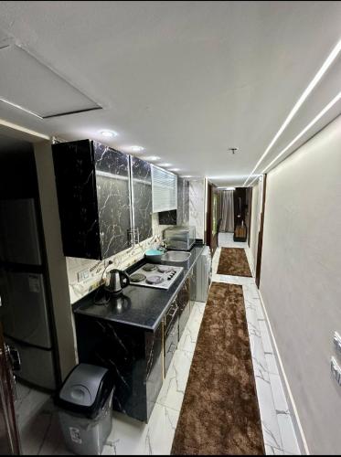 a kitchen with a sink and a counter top at شالية VIP باهرامات بورتو السخنة in Ain Sokhna