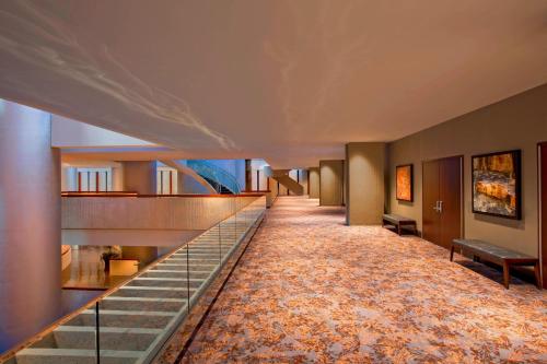 a long hallway with a staircase in a building at The Westin Peachtree Plaza, Atlanta in Atlanta