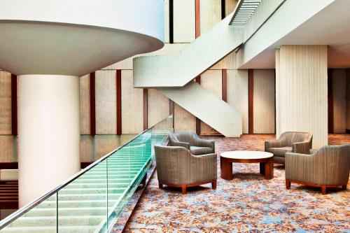 a lobby with stairs and chairs and a table at The Westin Peachtree Plaza, Atlanta in Atlanta