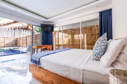 Postel nebo postele na pokoji v ubytování Seri Resort Gili Meno - Adults Only