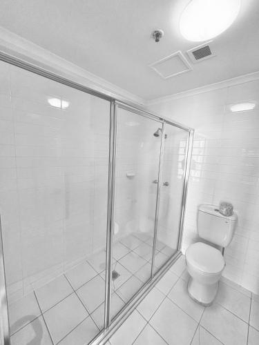 a bathroom with a shower and a toilet at Private room with Balcony in Sydney