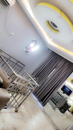 a stairwell in a room with a staircase in a building at Fortune Solar Hotel in Abuja