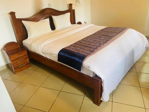 מיטה או מיטות בחדר ב-Ruhondo Beach Resort