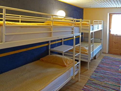 a room with three bunk beds in a room at Hauser-Hof Modern retreat in Marktoberdorf