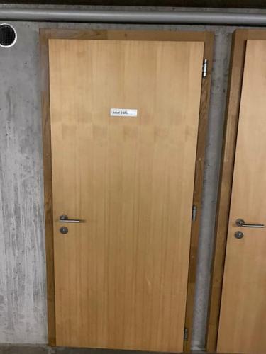a wooden door with a sign on top of it at Penthouse spa access , 6 bedroom, 6 baths by Jolidi in Nendaz