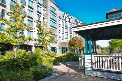 a building with a pavilion in front of a building at Holiday Inn & Suites North Vancouver by IHG in North Vancouver