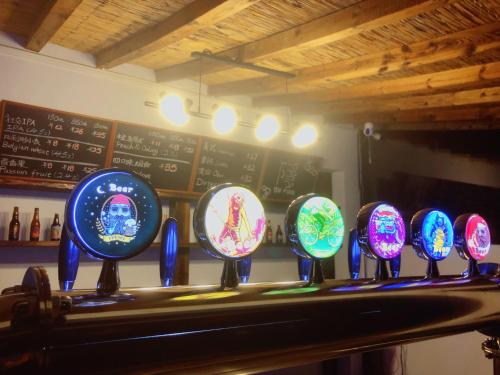 a bar with a bunch of plates on a counter at 隐谷私院The Great Wall Valley in Gubeikou