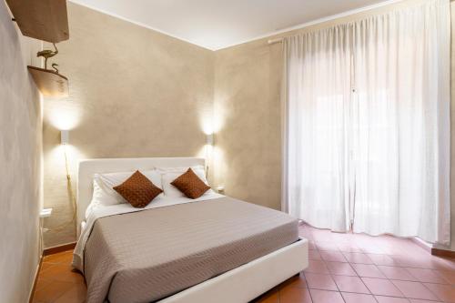 מיטה או מיטות בחדר ב-Rita Apartment in Trastevere