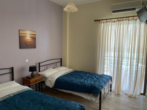 Postel nebo postele na pokoji v ubytování Finikas
