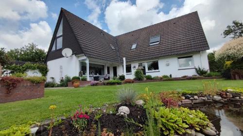 Κήπος έξω από το Ferienwohnung in Marienhafe