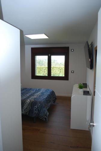 Postel nebo postele na pokoji v ubytování Casa los Canarios