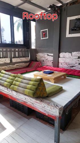 a room with several pillows sitting on a table at Dormsin Chill in Phi Phi Islands